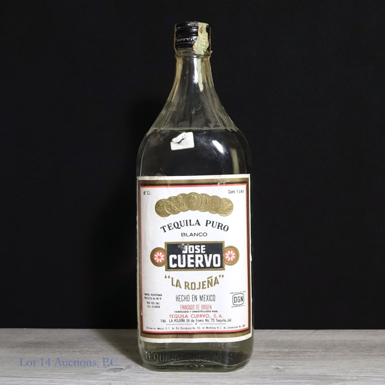 1970s Jose Cuervo "La Rojena" Blanco Tequila Puro: Jose Cuervo "La Rojena" Blanco Tequila Puro, 90 Proof, 1 Liter, estimated to have been bottled in the 1970s. Tax strips torn through on all ends and almost completely disintegrated, screw cap remains 