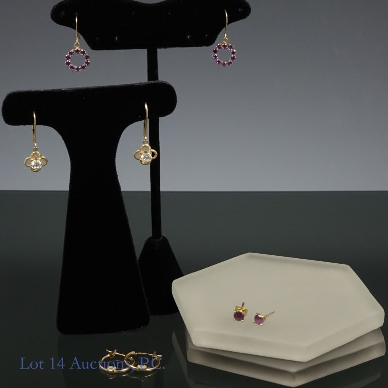 14k & 10K Y Gold Earrings (4 Pair): 4 pairs of yellow gold earrings. Two pair test electronically as 14 karat gold. One pair is marked "JCM 14K CZ". The stud air with purple stones are not marked, but one has a back marked "585" (one ba