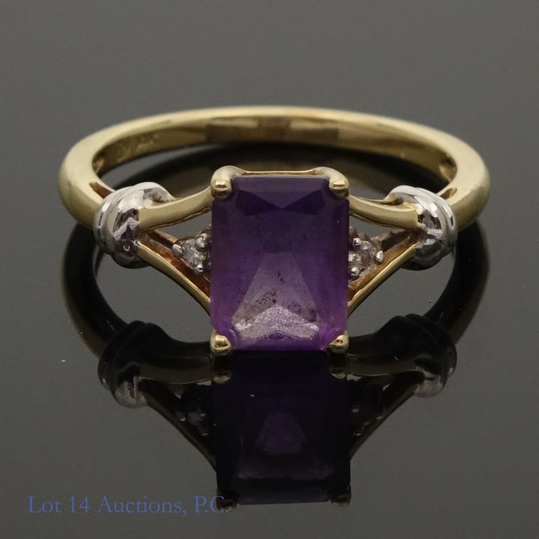14K Y Gold & Amethyst (?) Ring: Yellow gold ring. Marked "14K" and tests electronically as 14 karat gold. Purple stone tests electronically as amethyst. The two small side stones were not identifiable, except to confirm it is harder
