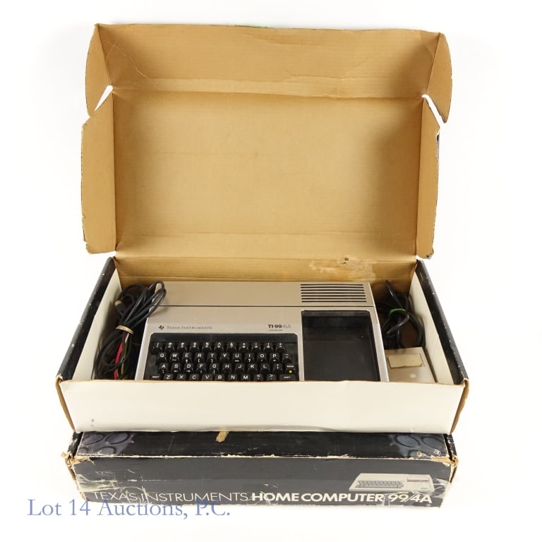Texas Instrument Home Computers (2): 1. 1983 Texas Instruments home computer 99 / 4A model PHC 004A with guides, accessories, and most original packaging. Box is is rough condition. 2. 1982 Texas Instruments black home computer 99 / 4A m