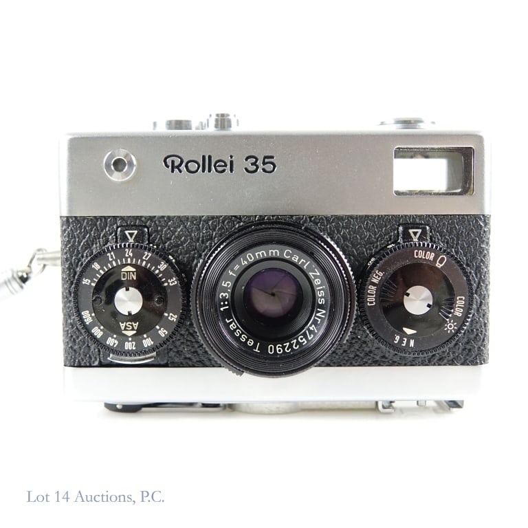 Rollei 35 35mm (Honeywell) Camera Made in Germany: *NOTE: The battery compartment had a battery and THERE IS CORROSION). Rollei 35 with Zeiss Tessar 40mm f/3.5 lens. NOTE: A prior owner engraved his name and city on the back at the bottom. The shutter