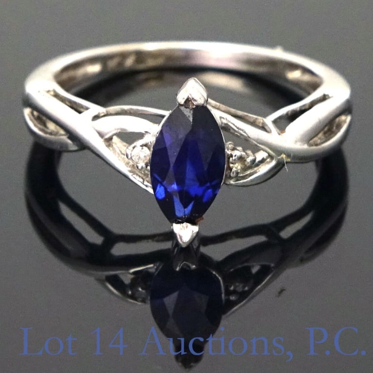 10k White Gold Ring Blue Sapphire, Diamonds Sz 4.5: 10k white gold ring, size 4.5, with .4ct blue sapphire and 2 melee diamonds. 1.5g (.98dwt) total weight.