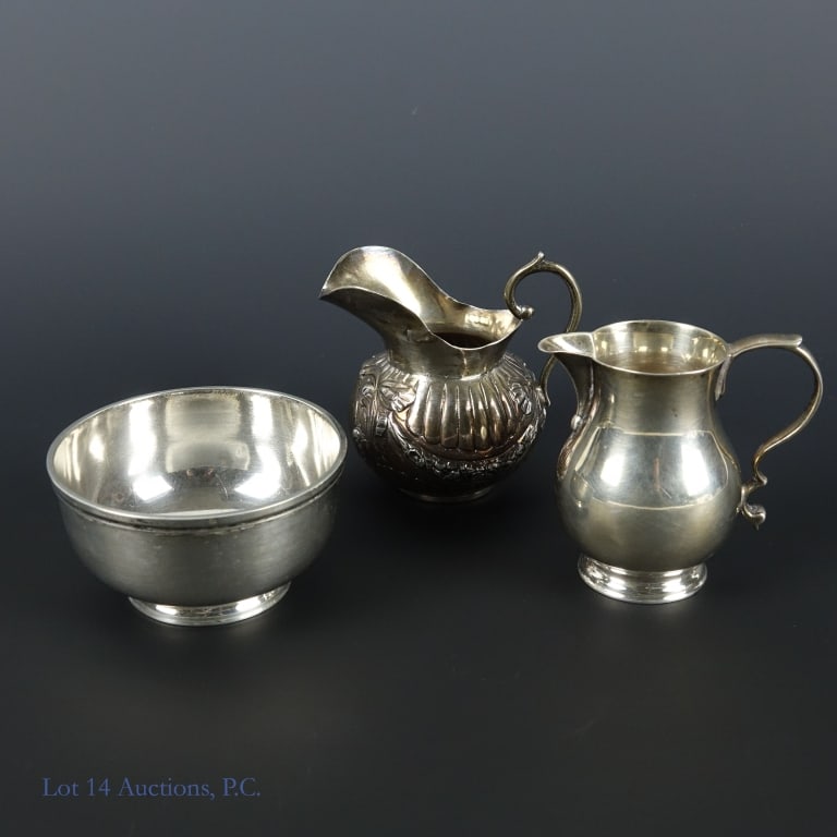 English Sterling Silver Pitchers (2) & Bowl: 1898 William Moering sterling silver pitcher. Bottom is marked with a fleur de lis and "930". Tests electronically as sterling silver. Approximately 3" tall. Weight: 56.60 grams. ***** 1947 Thomas Duc