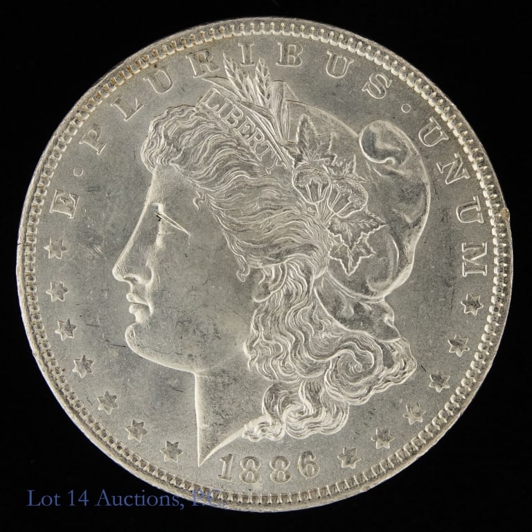 1886 (P) USA Silver Morgan Dollar (GEM BU): 1886 United States silver Morgan dollar (Philadelphia Mint). Designer is George T. Morgan. Per consigner, grades GEM BU with great surfaces. Metal is 90%-silver, weighs 26.73 grams and measures 38.1 m