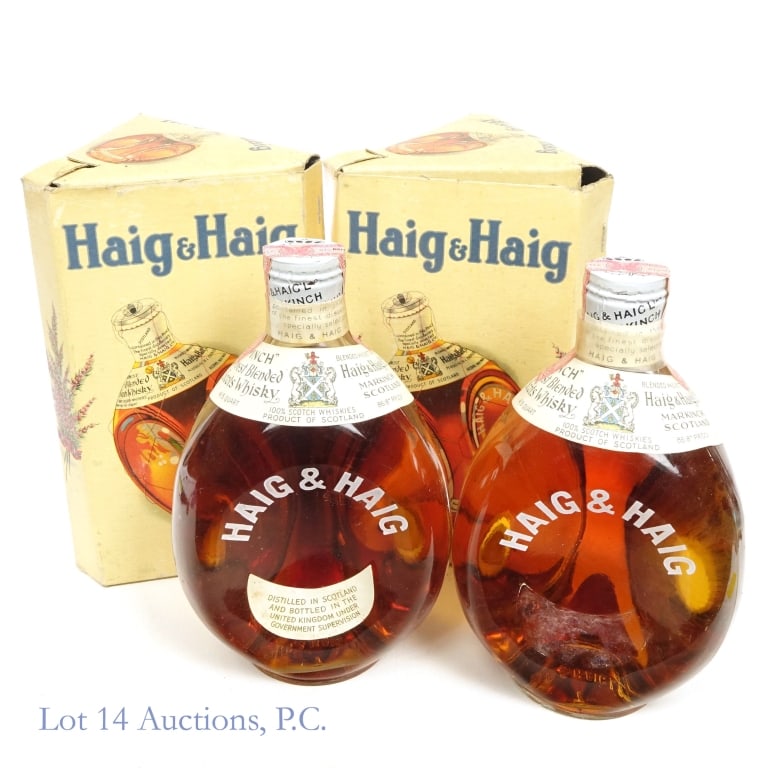1940s / 60 Haig & Haig Pinch Blended Scotch (2): 2 bottles total in this lot. Haig & Haig Pinch Blended Scotch, 86.8 Proof, 4/5 Quart, early 1940s-1960 bottling (x2). Tax strips on both bottles in very good condition with no visible tears or scuffs.