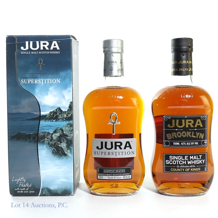 Jura SM Scotch Whisky Brooklyn & Superstition (2): Two (2) bottles of Jura Single Malt Scotch Whisky. #1 - Jura "Superstition" Lightly Peated Single Malt Scotch Whisky, 43%abv, 750ml, with box (box is cut and damaged). #2 - Jura "Brooklyn" in collabor