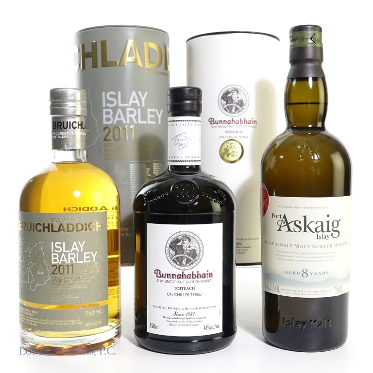 Bruichladdich, Bunnahabhain, Askaig Islay Scotch 3: Three (3) Bottles of Islay Single Malt Scotch Whisky. #1 - Bunnahabhain Single Malt Scotch Whisky Toiteach, 46%abv, 750ml, in canister. #2 - Bruichladdich Islay Barley, 2011 Unpeated Single Malt Scotc