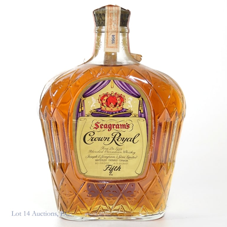 1964 Crown Royal Fine De Luxe Canadian Whisky: Crown Royal Fine De Luxe Canadian Whisky, 80 Proof, 4/5 Quart. Tax strip has minor tears but intact overall.