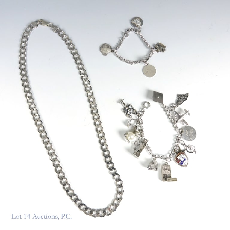 Sterling Silver Curb Necklace and Charm Bracelets: Curb link chain necklace. Marked "925 Italy". Lobster claw catch. Approximately 22" long. Weight: 47.8 grams. ***** Curb link charm bracelet with four charms. Marked "sterling". All four charms marked
