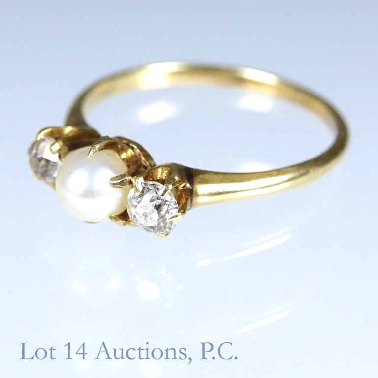 "18K" Yellow Gold Pearl & Diamond Ring: Yellow gold ring. Marked "18k" followed by a star. Electronically and acid tests at 16 kart gold. Two side stones test electronically as diamond. Size: 3.5. Weight: 1.30 grams.