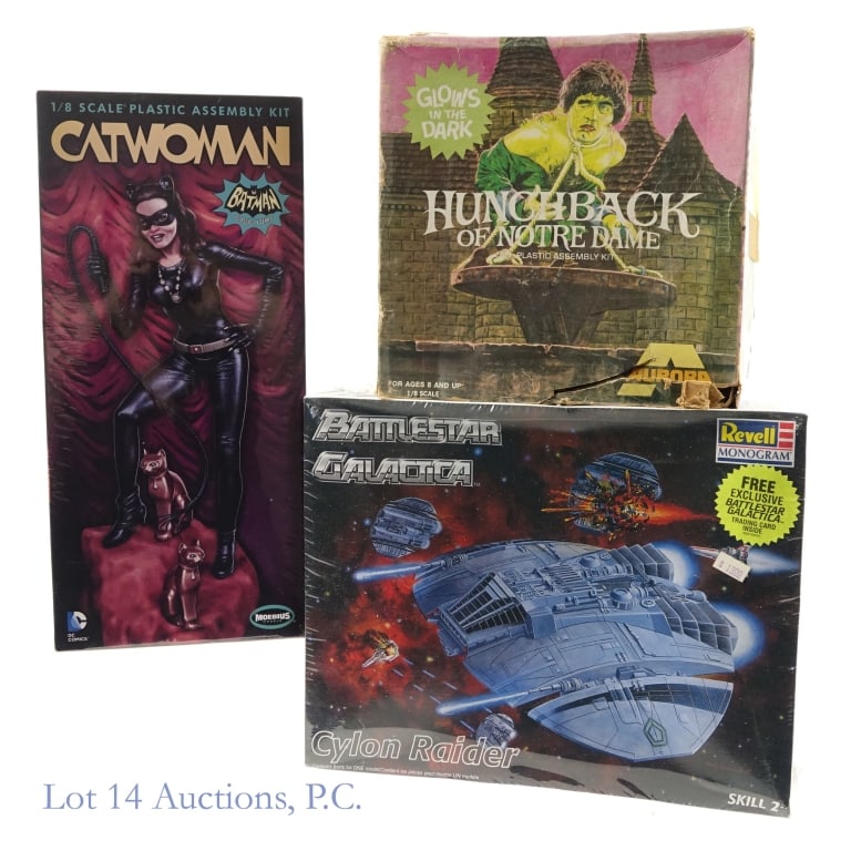 Hunchback and Catwoman Model Kits (3): Hunchback and Catwoman Model Kits (3). Collection of complete, unbuilt model kits. 1972 Aurora, Hunchback of Notre Dame, Glow in the Dark, complete (per consigner) - stickers, tape, cuts and tears on