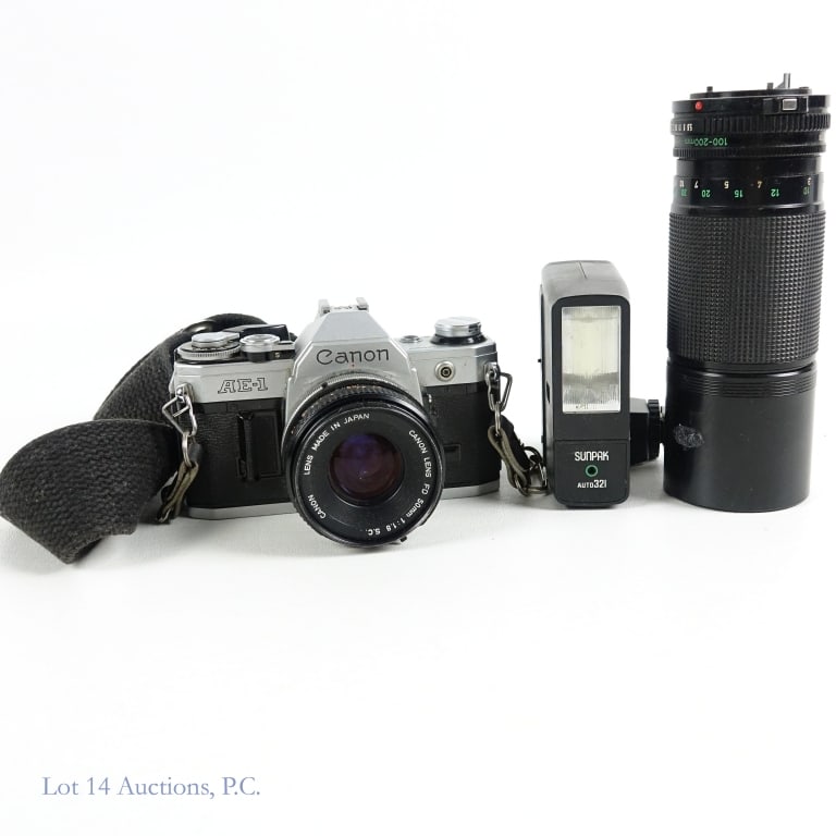 Canon AE-1 Camera w/ 50mm,100-200 Zoom Lenses: Canon AE-1 Camera w/ 50mm,100-200 Zoom Lenses. Canon camera and accessories. Canon AE-1 camera - #1866865. Canon FD 50mm, 1:1.8 S.C. lens. Canon FD 100-200mm, 1:5.6 zoom lens. Sunpak auto 321 flash. V