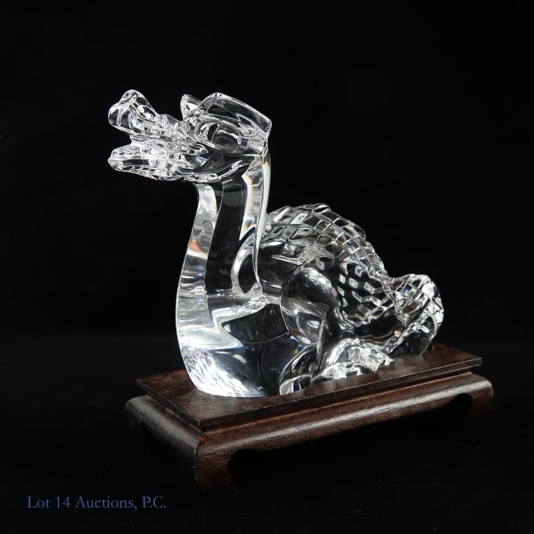 Baccarat Crystal Dragon & Stand: Crystal dragon figurine. Bottom stamped with Baccarat mark and embossed Baccarat signature on left breast of the beast. Approximately 5.5" long x 4" tall. Weight of crystal piece: 0.86 pounds (390 gra