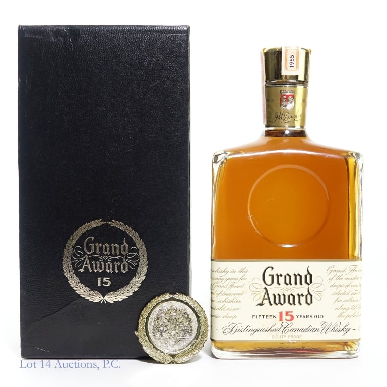 1955 J.M. Douglas Grand Award 15 Yr. Whisky: J.M. Douglas & Company 15 year old Canadian Whisky. 4/5 Quart, 80 proof. Bottle No. B 188950. 1955 on Canada tax strip. Medal on bottle fell off, but is included.