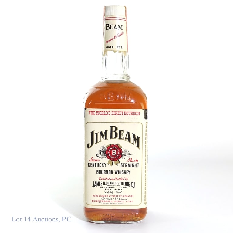 1960s - 70s Jim Beam 4 Year Bourbon: Jim Beam 4 Year Sour Mash Bourbon, 80 Proof, 750 ml, early 1960s - late 1970s tax strip, unreadable glass molding. Some sediment visible in bottle.