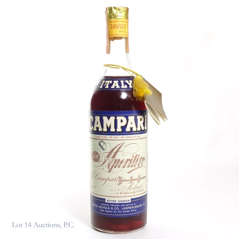 Campari Aperitivo Liqueur (1972-73), Carmine Dye: Campari Aperitivo Liqueur with Carmine Dye. Bottle shows 1973 molding with a series 112, U. S. Internal Revenue tax strip. 48 proof, 4/5 quart. Label has some wear on edge. Some sediment visible in li
