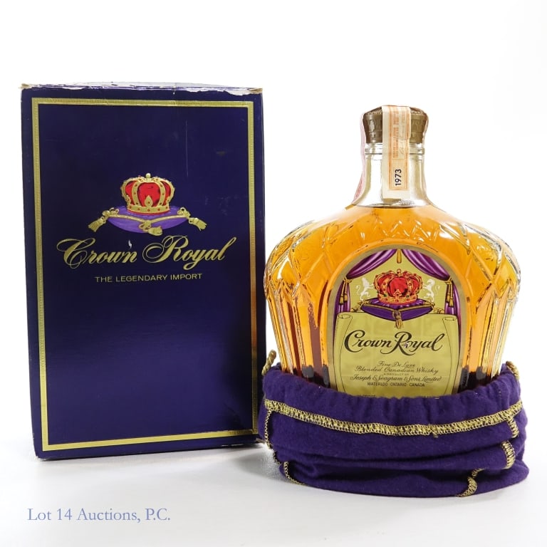 1973 Crown Royal Fine De Luxe Canadian Whisky: Crown Royal Fine De Luxe Blended Canadian Whisky, 80 Proof, 750 ml, Distilled: 1973. Tax strip in good condition with little tears, see photos for details. Original box and bag included.