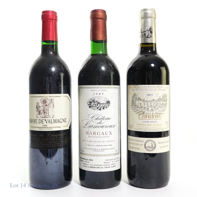 Three French Red Wines: Three bottles of red wine, all originating in France. Lot includes: 1987 Chateau de Lamouroux Margaux, 12% ABV; a 2005 Chateau Condom Cotes de Duras Cuvee Delph, 13.5% ABV; and a 1993 Abbaye de Valmag