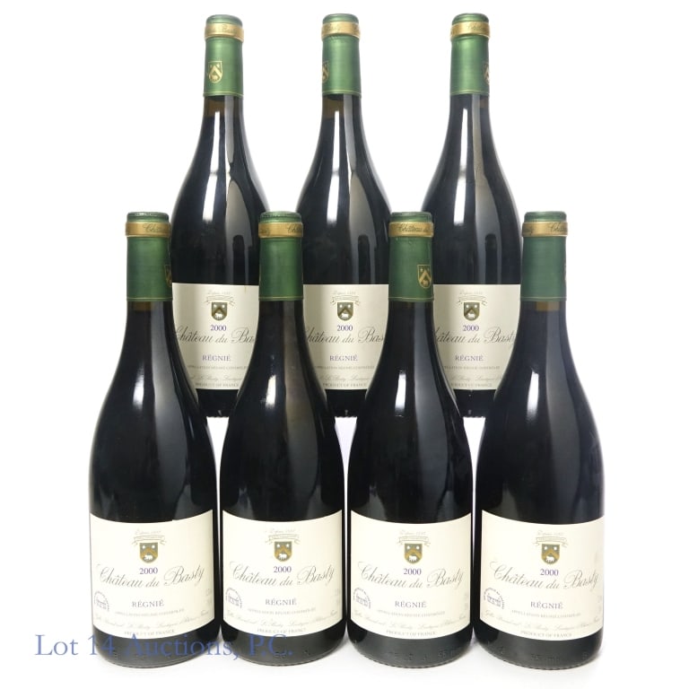 2000 Chateau du Basty Regnie Red Wine (7): Seven (7) bottles in this lot. 2000 Chateau du Basty Regnie Red Wine. Appellation Regnie Controlee. Imported by: C.S. Distributors Co. New York, NY. 750 ml. 12.5% ABV. Labels on two bottles have some