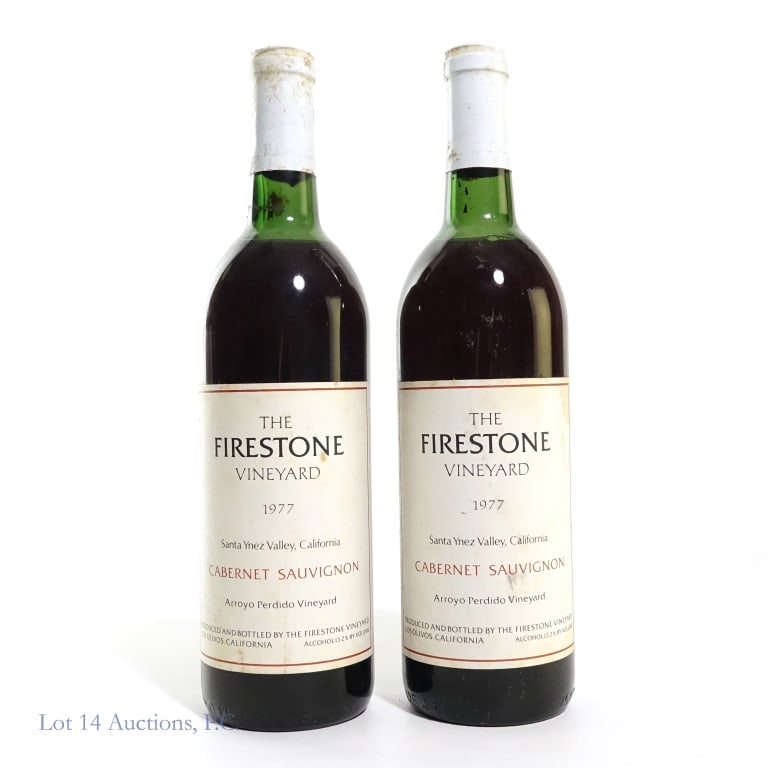 1977 Firestone Vineyard Cabernet Sauvignon (2): Two (2) 1977 The Firestone Vineyard Cabernet Sauvignon. Produced in Los Olivos, California. 13.2% Abv, 25.4 Fluid Ounces. See photos for label / capsule damage, condition and details.