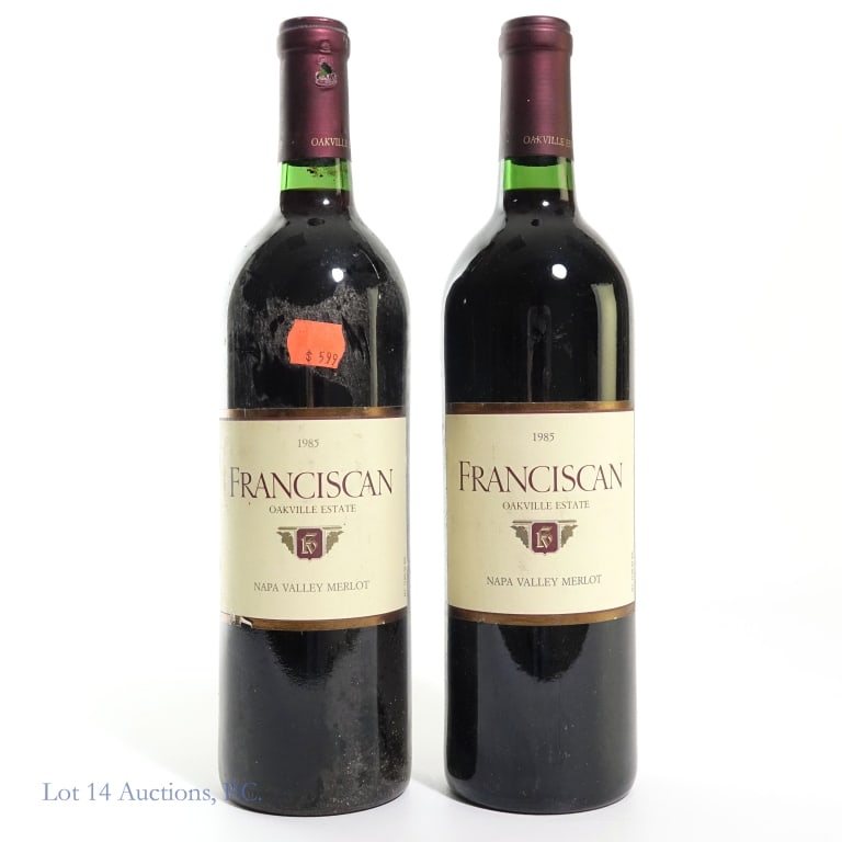 Two Bottles 1985 Franciscan Merlot: Two bottles of Franciscan Oakville Estate Merlot, bottled in 1985. Origin Napa Valley, California. 12.9% ABV. See photos for any label / capsule damage, condition notes, and details.