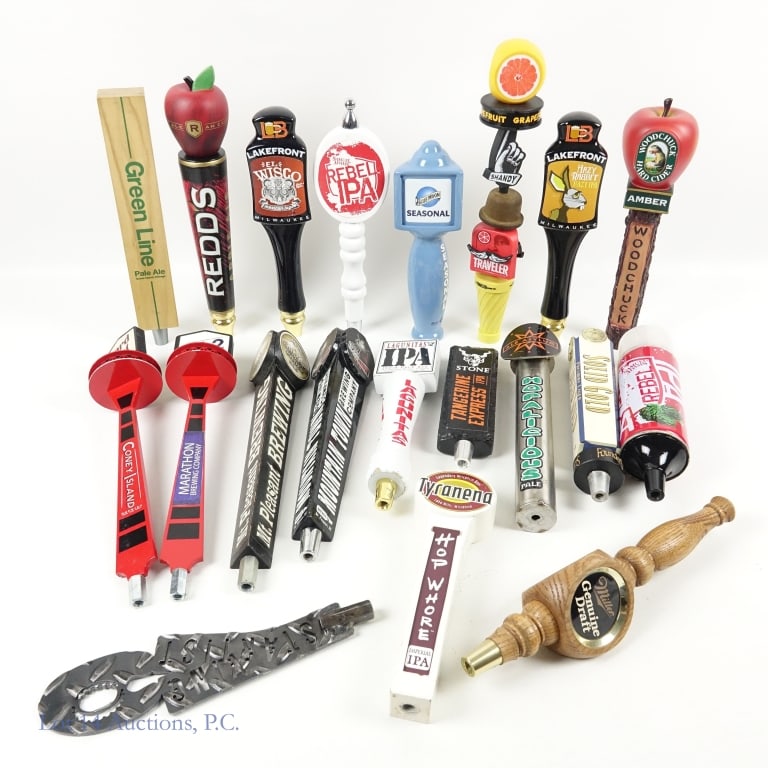 Beer Tap Handles (20): 20 beer tap handles. Conditions vary, but all seem to have signs of use. Some handles includes: Ace Asylum (Hopalicious), Miller Brewing Company (Genuine Draft), Traveler Beer Company (Grapefruit Shan