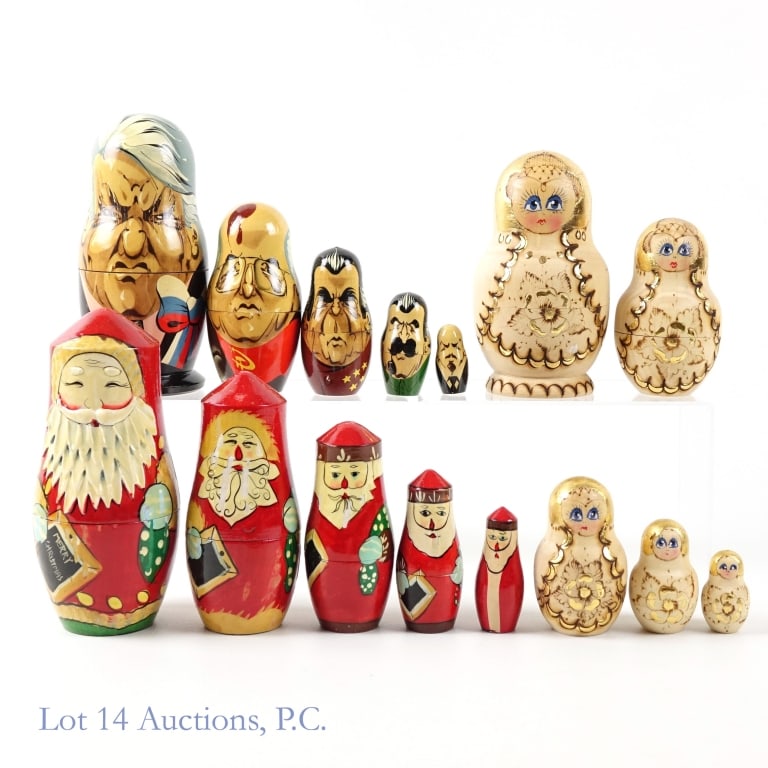 Three Vintage Russian Dolls: A lot of three hand painted wooden matryoshka dolls. The largest of the first set is 6'' tall and they are all painted to look like Santa Claus. The largest of the second is 5'' tall and they are all