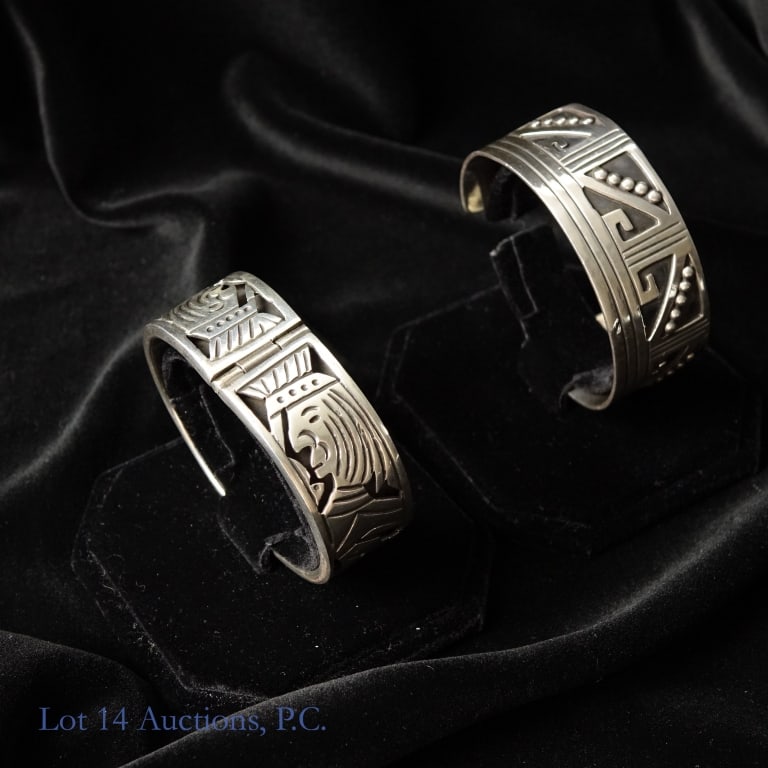 Sterling Silver Bangle and Cuff Bracelets (2): Sterling Silver bangle and cuff bracelets. Thick Sterling Silver bangle bracelet. Has depictions of kings and other designs. Weighs 66g / 2.122ozt and is approx. 2.5" diameter at widest point. Marked 
