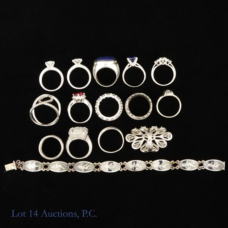 Assorted Sterling Silver Jewelry (80g): 14 Sterling Silver Rings and 1 Siam Sterling Silver bracelet. Whole lot weighs 80g/2.57ozt. 11 rings are size 5, 1 is size 6, 1 is size 7, and 1 is size 9. All stones in rings are not real. Bracelet i