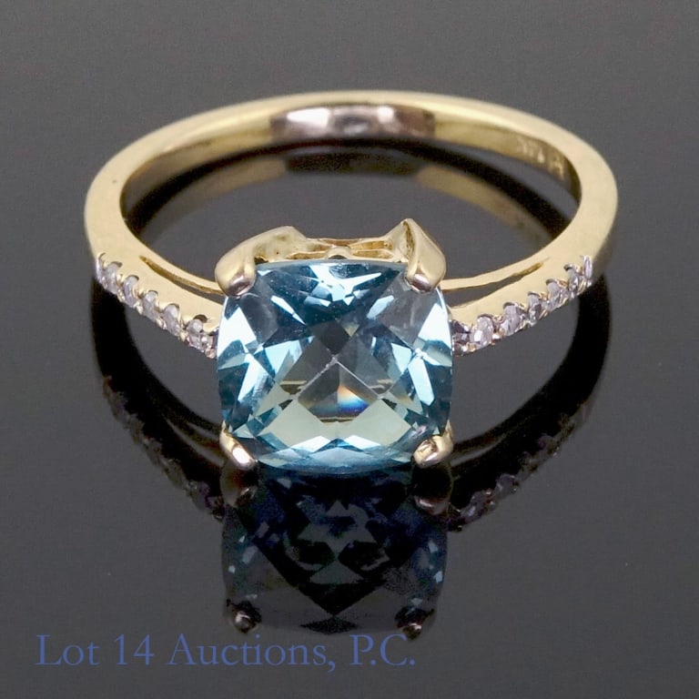 14k Gold Ring With Diamonds and Sapphire: Size 7 ring made with 14k gold. One large green sapphire flanked on either side by five melee diamonds (10 total). 2.8g. Good condition. Engraved on the inside with "14k" and what appears to be a make