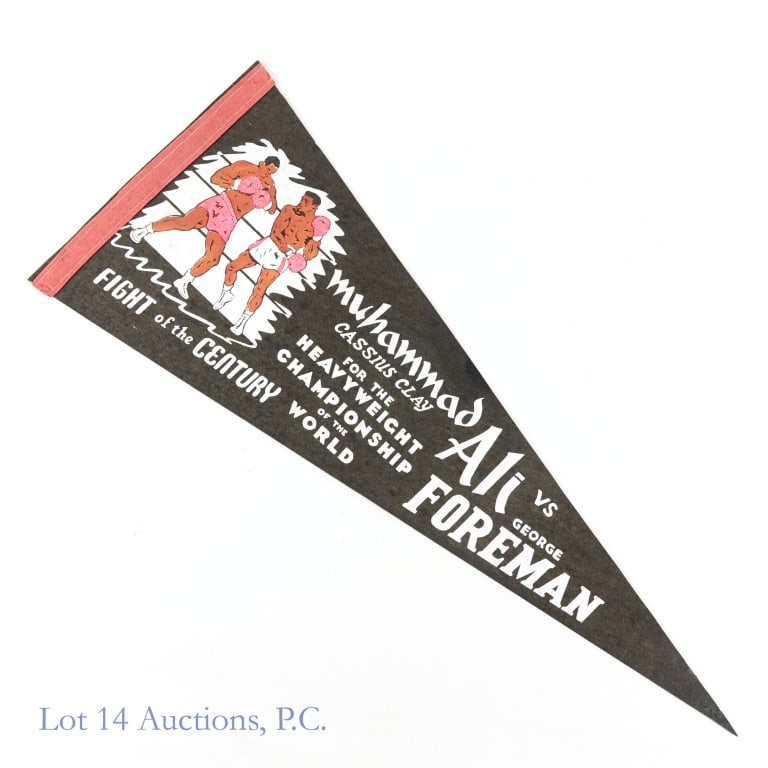 1974 Ali v Foreman Rumble in the Jungle Pennant: Black stiff felt pennant from the legendary "Fight of the Century" between Muhammad Ali and George Foreman. 29.25" long x 12" tall at the hoist. Two small pinholes at top and bottom of the hoist and m