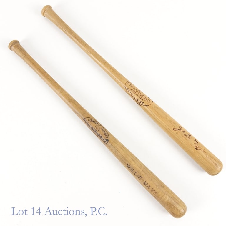 Willie Mays & Joe Di Maggio Mini Baseball Bats: Two vintage 16" long mini-baseball bats. Both bats have wear commensurate with their age: Hillerich & Bradsby Co Louisville Slugger 125 with "Willie Mays" embossed on the bat. The "S" is somewhat fade
