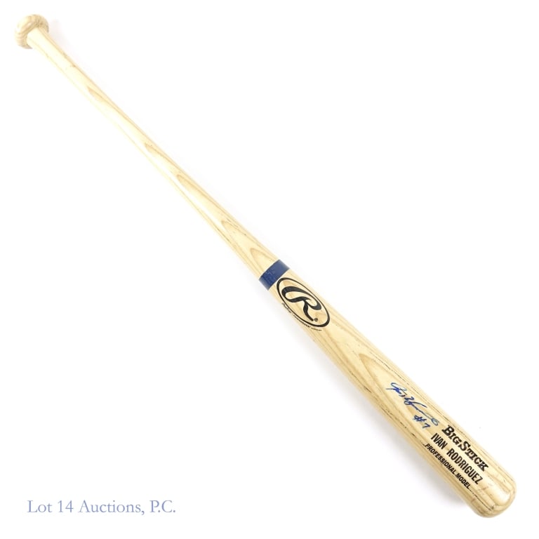 Ivan Rodriguez Signed Baseball Bat: This lot is sold "as is" with no guarantee or COAs. Rawlings Big Stick Professional Model blonde baseball bat. Autographed in blue by Ivan Rodriguez and inscribed " #7". Knob of bat embossed "34". Bat