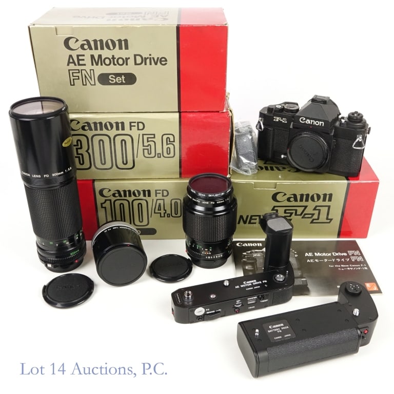 Canon F-1 Camera, Lenses, Motor Drive Set: Canon New F-1 Camera, two lenses, and motor drive set: Canon AE Motor Drive FN Set for the Canon New F-1, in original (opened) box. Includes AE Motor Drive FN (approx. 5.5" across and 4" tall) and Bat