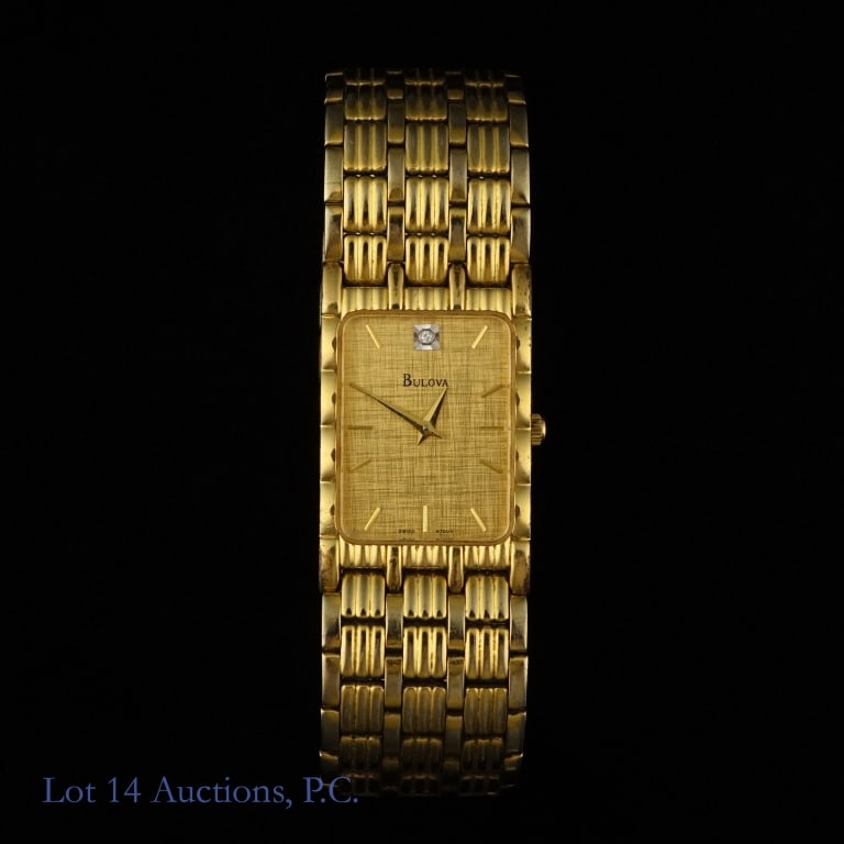 Vintage Bulova Quartz Watch: Gold toned quartz watch with a diamond accent at the 12:00 mark. Brand new battery, looks to be working great. Gold coloring on the stainless steel band is fading in places. It appears to be the 97D05