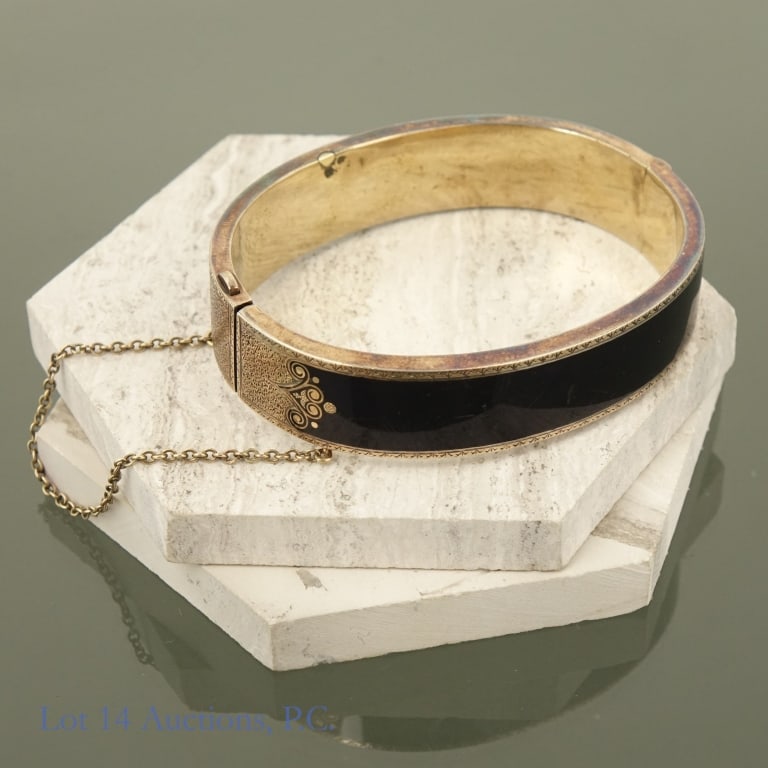 Victorian Mourning Bracelet 14k Gold: A mourning bracelet, likely from the latter half of the 19th century, made with 14k gold and black enamel. The hinge and chain are in good condition. Bracelet needs cleaning but is overall well preser