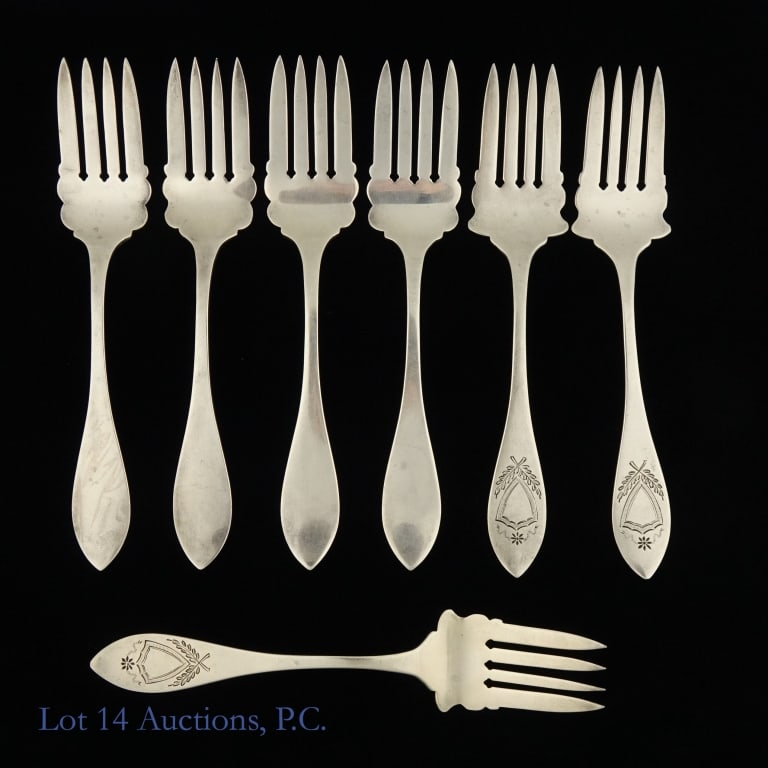 Seven Sterling Silver Forks: Seven 5'' forks made of sterling silver. Three have a design on the handles while the other four are plain. Together they weigh about 114g and are in good condition.