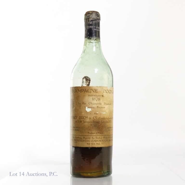 1878 Berry Bro's. Champagne Cognac **: 1878 (distilled) Berry Bros & Co. 3/4 Qt bottle, 80 Amer. Proof Charente District, Cognac, France. ** Cork is below bottle top and this bottle's contents seeped badly when it was shipped to us by the 