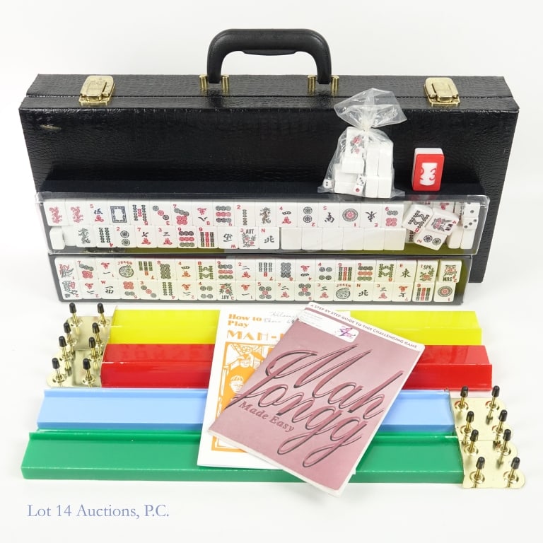 Complete Mahjong Set: Complete Mahjong Set. Includes tiles, dice, 4 colored racks, and 2 instruction manuals. All pieces of the game are stored in a black case. The case measures 9.25"L x 20.5"W.