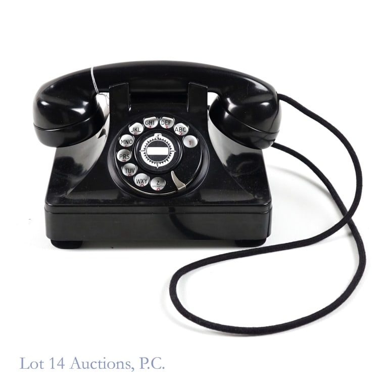 North Electric Rotary Dial Phone: North Electric Rotary Dial Phone. Measures approximately 5.5"W x 7.75"L x 5.5"H. The phone is still in working condition - compatible with modern landlines.