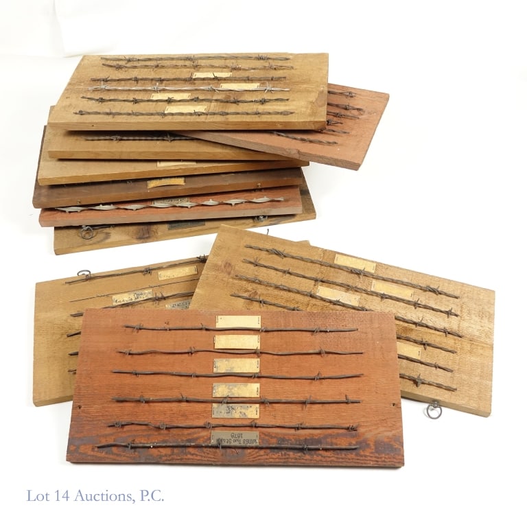 Barbed Wire Collection Display of 58 Strands: Collection of 58 different barbed wire strands displayed on 10 rough sawn cedar boards. 9 of the boards have 6 strands each, while 1 board has 4 strands. There is a description under each strand of wi