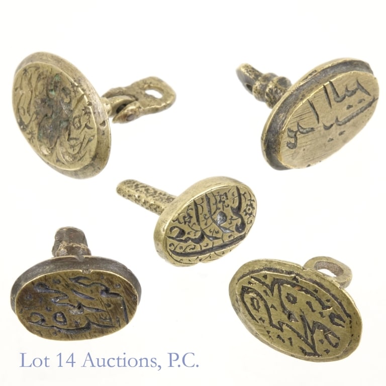 Arabic / Islamic Bronze Wax Seals - 19th c (5): Five (5) Arabic / Islamic bronze wax seals. 19th century. Various forms and text. Largest seal measures approximately 1" x 5/8" across the face. The five total weigh 33.4 grams.