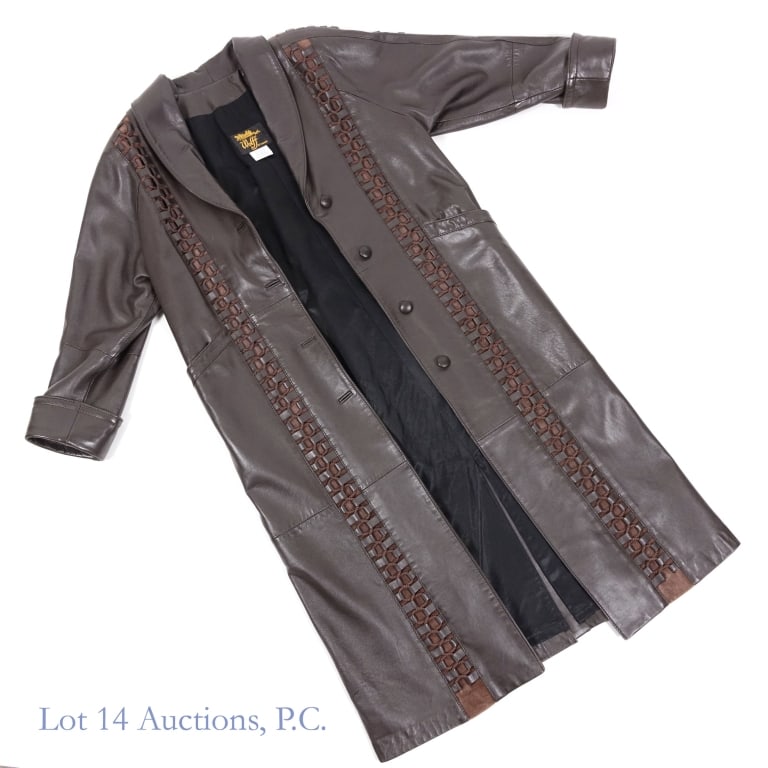 Wolff Woman's Leather Long Coat: Woman's long coat by Wolff of Canada. 100% leather outer shell - 100% polyurethane backing - 100% polyester lining. Jacket length approximately 48.75". Top-to-Top approximately 16.5". Sleeve length ap