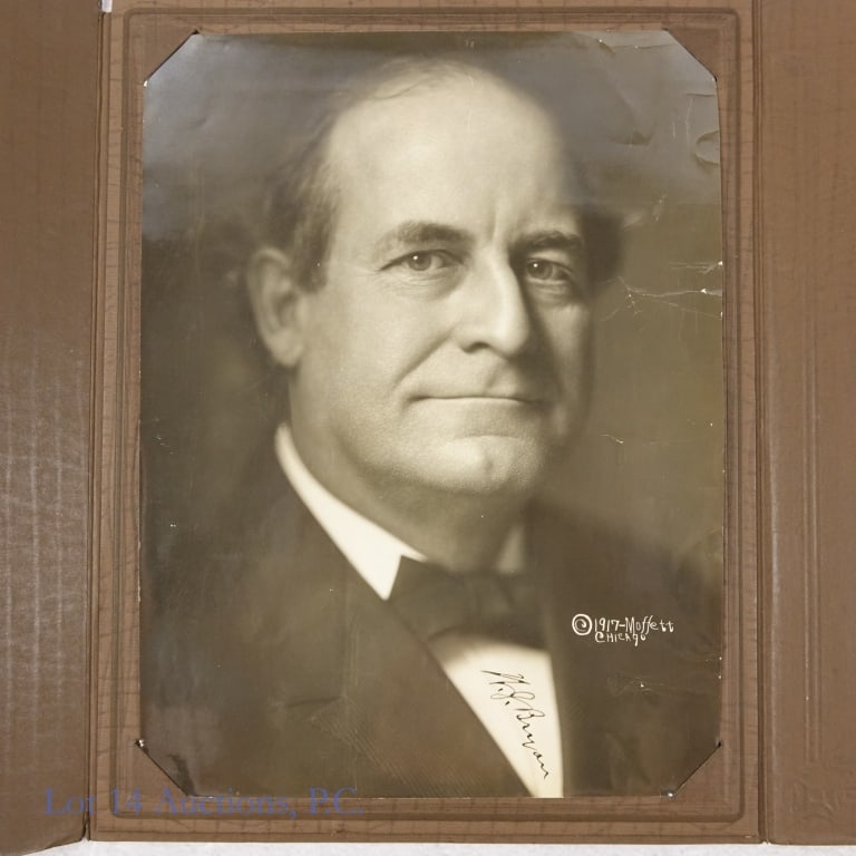 William Jennings Bryan Autographed Photo: Black & white photograph of William Jennings Bryan. Photo has a 1917 copyright for Moffett of Chicago. Signature "W.J. Bryan" appears on Mr. Bryan's shirt below his bow tie. On back is written "With c