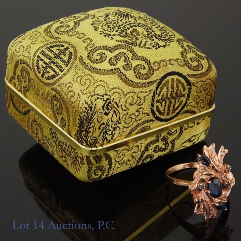 10k Rose Gold Cocktail Ring: Rose gold cocktail ring. No markings, but acid tests at 10 karat gold. Electronic testing of stones was inconclusive. Size: 9.5. Weight: 3.85 grams. Comes in a Ming's jewelry box.