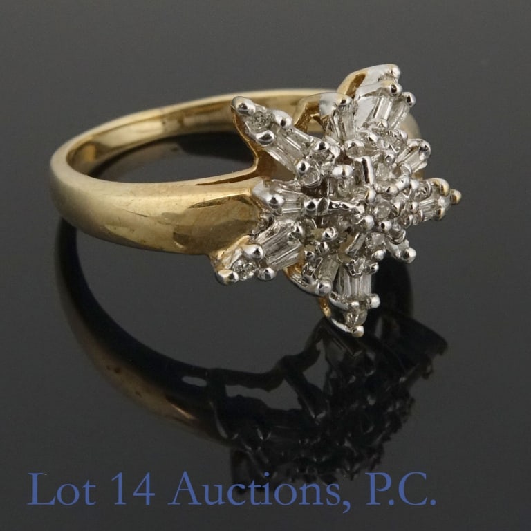 10K Y Gold Diamond Ring: Yellow gold ring. Marked "A31" and "10K". Electronically measures as 10 karat gold. Stones electronically test as diamond. Size: 7. Weight: 3.55 grams.