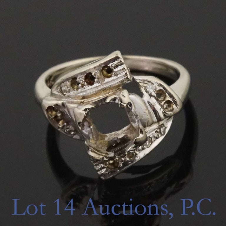 14k W Gold Ring Setting (Most Gem Stones Removed): 14 karat white gold ring setting - most gem stones have been removed, but 3 small accent stones. Stamped "14K". Tests electronically as 14 karat gold. Size 4.75. Weight: 3.55 grams. The hole under the