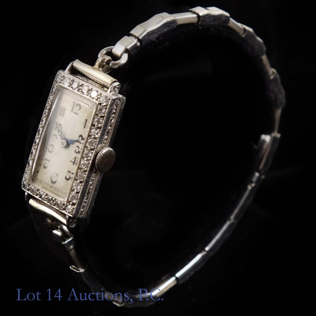 Lafond Platinum & Diamond Ladies' Watch, Swiss: Platinum Ladies' watch with unmarked dial. Movement is marked 17 jewel, Swiss, "J. Lafond", 15065. Inside of case back is marked IRID. PLAT. PATENTED JULY 26, 1921, 314914. 30 melee diamonds surround 
