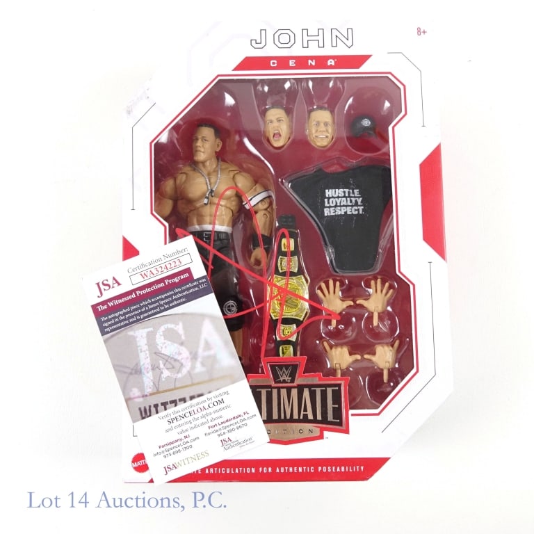 John Cena Signed Action Figure in Box (JSA): Mattel WWE Ultimate Edition John Cena articulated and posable action figure. New in sealed box. Front of box is signed by John Cena in red. JSA "Signed in the presence" authentication sticker and cert