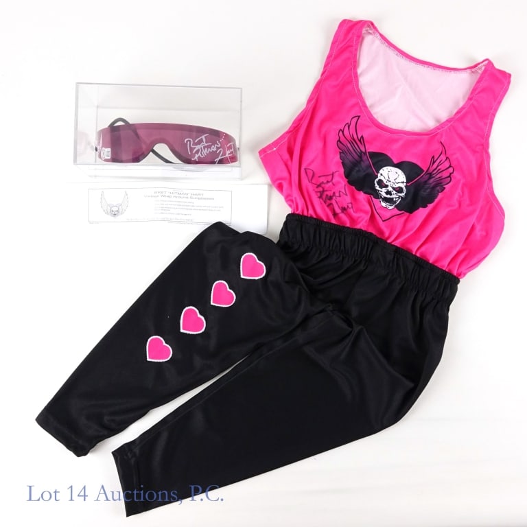 WWF / WCW Bret Hitman Hart Signed Outfit Glasses, JSA & Beckett: WWF / WCW wrestler Bret "Hitman" Hart signed wrestling outfit and wraparound sunglasses. Sunglasses come in a plexiglass display case. Wrestling outfit JSA COA: WA283592. Wraparound sunglasses Beckett